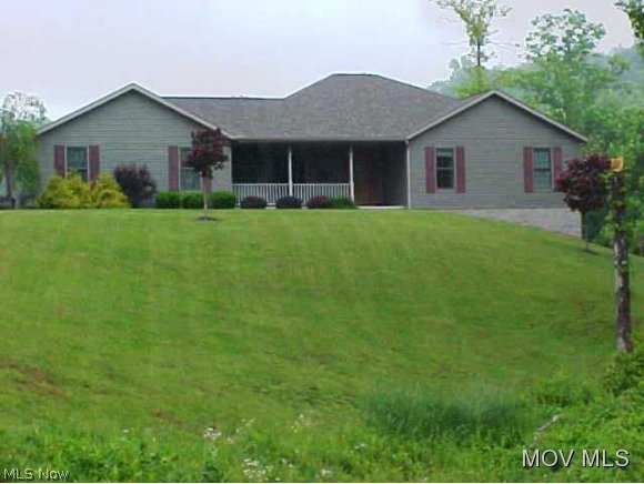 Offering custom cabinets with lg. bar open to family room w/ french doors to back patio, expansive hallway, mater suite w/ claw foot soaking tub, overszied rec room in walkout basement, exercise room, sewing room laundry room w/ utility sink. Home offers solid wood doors, wood floors throughout, ceramic tile, wood insulated windows. Office is 4th bedroom, formal dining room, central vac and so much more! Beautiful setting with pond and woods. Basement is plumbed for kitchen. Also have option of going to Warren Schools w/ bus pick up. Owners do not own mineral rights. Elem: Harmar Elementary School Elem/Bus: Y JrHigh: Marietta Middle School School JrHigh/Bus: Y High: Marietta High School High/Bus: Y Fire: VOL Police: SHF PossFreeGas: N ;SQFT=Fin L1:1744, Fin Bsmt:1369, Fin Above:1744, Fin Total:3113, Unfin L1:0, Unfin Bsmt:375, Unfin Above:375;GAR= 2 Car Att, Opener(s);PRKG= Parking Pad
