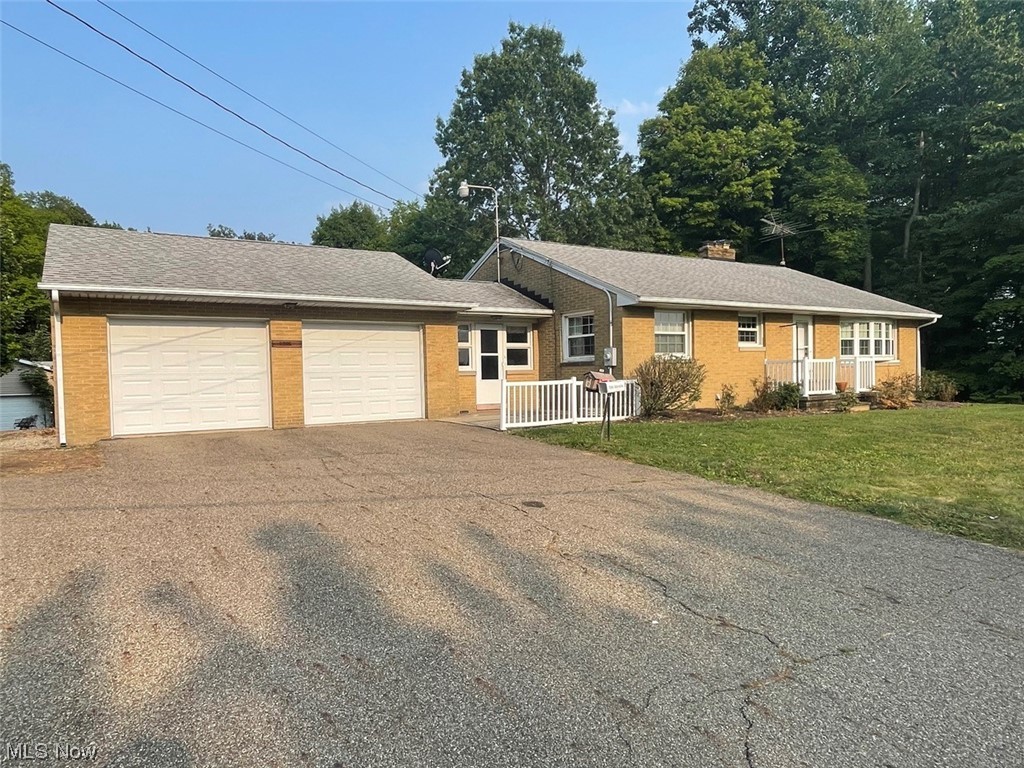 Attention Hobby Enthusiasts - Good Brick Ranch On 3.4 Acres - 2-Car Attached Garage – 4-Car Detached Workshop - Washington Twp. – Stark Co., OH – Marlington Local Schools - Live Auction with Online Bidding Available - ABSOLUTE AUCTION, all sells to the highest bidders on location. ONLINE BIDDING BEGINS SATURDAY, AUGUST 12, 2023 – 10:00 AM and AUCTION LIVE ON-SITE BIDDING WILL BEGIN TUESDAY – AUGUST 15, 2023 – 5:30 PM. Stark Co. parcels #7504606 and #7505172 comprise 3.41 acres total. Nice partially wooded land with a stream and a nice backyard. Well-built brick ranch built 1958 with updates including vinyl windows, spacious kitchen with island, larger master bedroom, finished walkout basement with rec room and fireplace, bedroom, full bath, laundry room, and storage. The main level has 2 bedrooms, a full bath, a living room, a nice white kitchen, breezeway, and 2 car attached garage. Outbuildings include a 28’x32’ garage with door, concrete, and elec. Built 1988 plus 32’x34’ overhead.