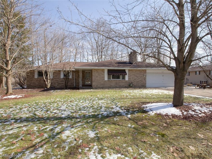 A must see brick ranch on a wooded lot.  You will love the privacy the back yard has to offer while enjoying the terraced deck. The family area and dinning room are open providing the perfect gathering space for entertainment and family meals.  The kitchen provides generous counter space with a large pantry. The convenience of the pass thru to the dinning area is an added touch.  Master bedroom has a private bath.  This home is set up for growing family.  Don't miss your opportunity, call for your private showing today.