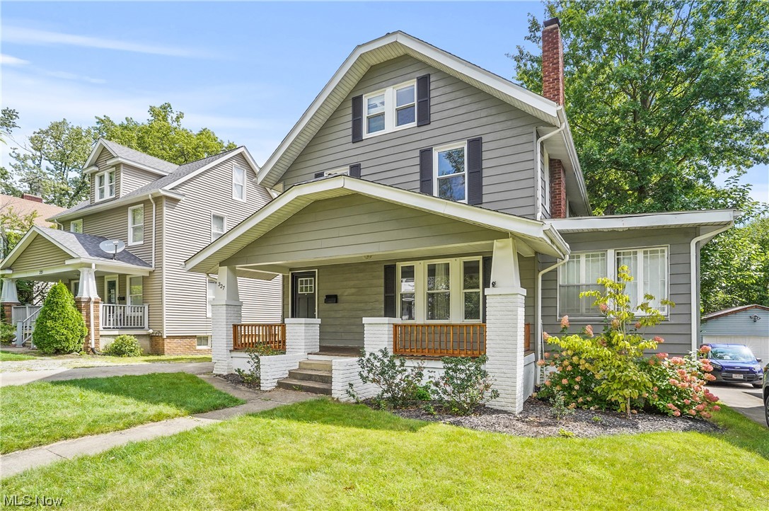 Check out this spacious colonial with a great covered front porch located in Akron! Situated closely to Highland Square, Lock 3, highways, and Downton Akron! This home has high ceilings and hardwood floors throughout. Park your car out back and enter through the back entryway mudroom where there is plenty of built in storage - along with a half bath. Come through a modern, bright kitchen offering stainless steel appliances, enough cabinets for storage, and is open to the large dining room where you will be met with a set of beautiful French doors leading into the living room! Cozy fireplace for you to gather around and enjoy some family time! Three to four bedrooms upstairs with extra space to use as you see fit and there is a full bathroom. Unfinished basement has laundry and storage area. Two car detached garage. HWT-2023. Move in ready!