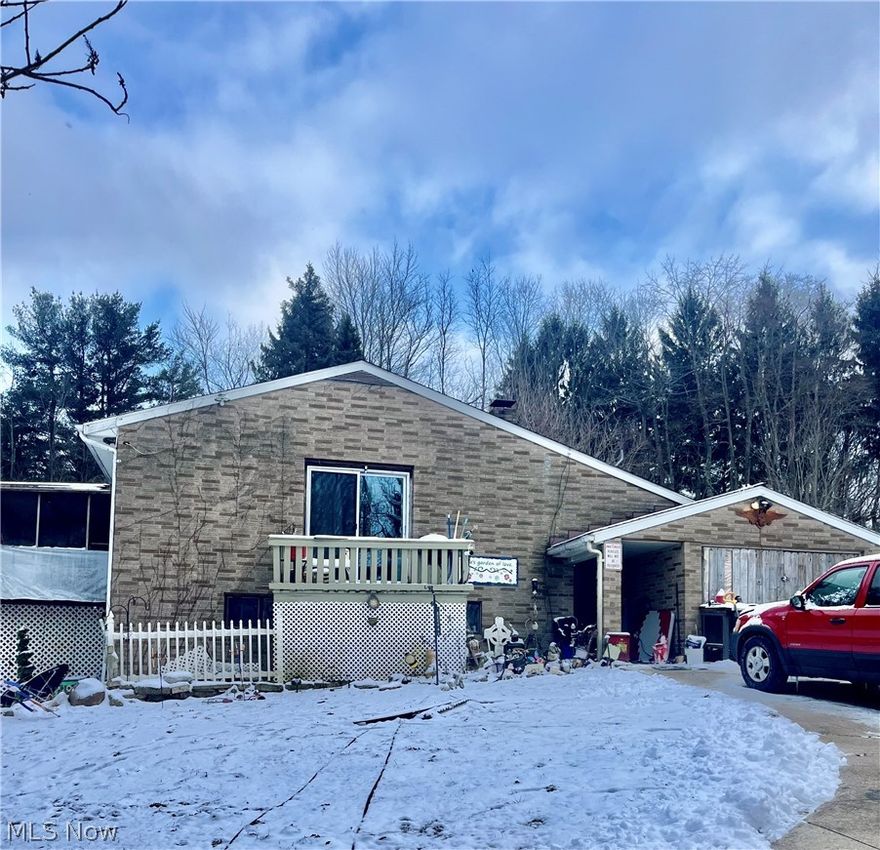 A HIDDEN GEM! Nestled on 2.3 picturesque acres, this 3-bedroom, 2-bath ranch offers space, character, and endless possibilities to make it truly your own with over 2,000 sq ft. living space. An inviting indoor porch welcomes you before going through the front door, setting the tone for the warmth and charm found throughout the home. One of the standout features is the stunning floor-to-ceiling stone wall that beautifully frames both the upper and lower staircases, creating an impressive focal point you won’t find just anywhere. The upper level boasts an open-concept layout with an oversized living room highlighted by vaulted ceilings and a large picture window that fills the space with natural light. The dining area flows seamlessly into a bright three-seasons room overlooking the expansive yet serene backyard the perfect spot to relax and enjoy peaceful country views. The spacious kitchen offers abundant cabinet storage and functionality, while three comfortable bedrooms and a full bath complete the main level. Downstairs, the lower level significantly expands your living space. You’ll find a separate bar area, a massive den with walk-out access to the patio, a second kitchen, laundry area, a huge bonus room, and a full bath. Whether you envision additional bedrooms, a private office, home gym, or even in-law suite potential, the opportunities here are truly endless. This property offers comfort, charm, versatility and a little TLC will go a long way in transforming it into your dream home. Don’t miss your chance to own this unique retreat with acreage and character. This one won’t last!