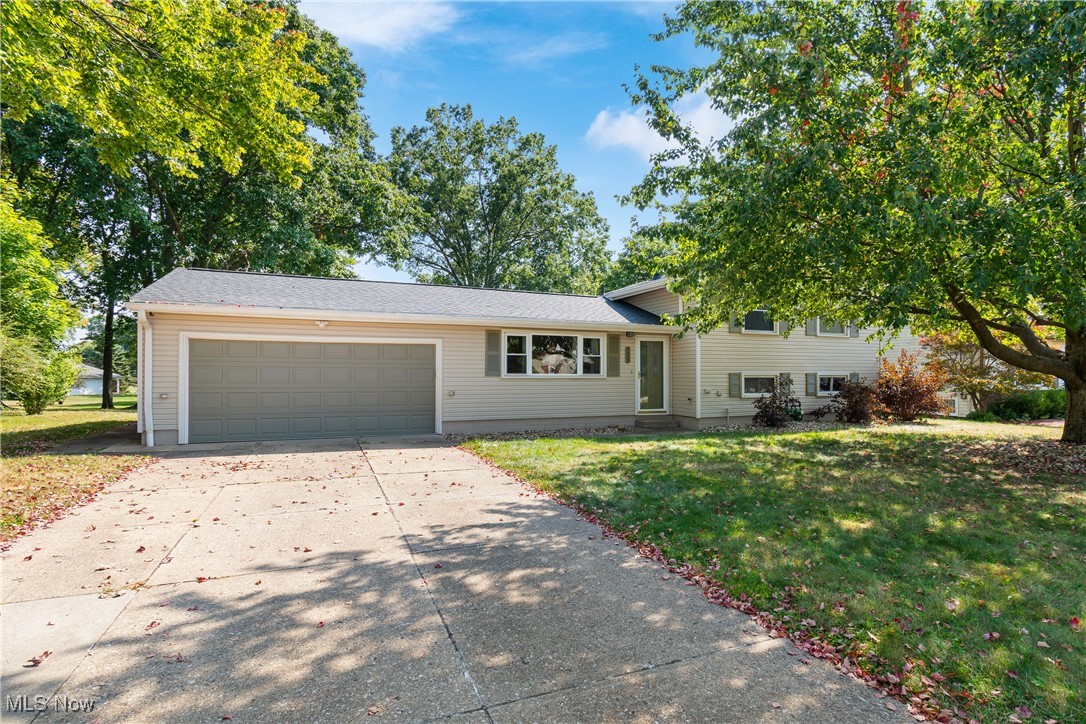 Welcome to this beautiful and well-maintained split level home located in the highly desirable Twinsburg area. This spacious residence offers 3 bedrooms and 2 full bathrooms, providing a comfortable and functional layout perfect for everyday living as well as entertaining. Step inside and immediately notice the soaring high ceilings in the living room, which create a bright, airy, and inviting atmosphere. Natural light fills the space, enhancing the open feel and highlighting the home’s thoughtful design. The kitchen is well-equipped with a full set of appliances and plenty of cabinet and counter space, making meal prep and hosting a breeze. Upstairs, you’ll find three nicely sized bedrooms with ample closet space. The full bathrooms located on the second floor and lower level are designed with convenience in mind, offering both style and functionality for today’s lifestyle. The lower level boasts a large family room—ideal for gatherings, movie nights, or simply relaxing at the end of the day. There's also an oversized laundry room with additional storage space. This flexible space can easily be adapted to suit your needs, whether as a recreation area, home office, or playroom. Enjoy outdoor living with a spacious yard, a playset and a rear deck, perfect for summer barbecues, and simply enjoying the peaceful surroundings. The 2-car attached garage provides convenience and additional storage. Located in a desirable area, this home combines comfort and convenience with easy access to local shopping, dining, parks, schools, and major highways.
Updates include: new roof 24', new furnace 23', new siding, new gutters, new flooring throughout and newer appliances 18'. Welcome to award-winning schools and beautiful park systems making this a great place to call home. Don’t miss your opportunity to own this move-in ready property with so much to offer—schedule your private showing today and see why this is the perfect place to start your next chapter!