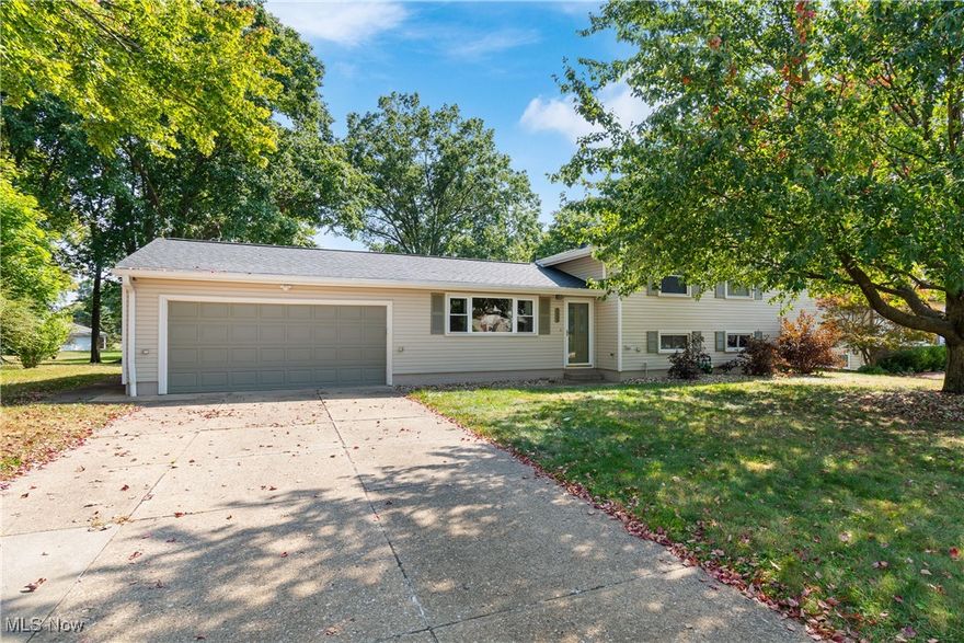 Welcome to this beautiful and well-maintained split level home located in the highly desirable Twinsburg area. This spacious residence offers 3 bedrooms and 2 full bathrooms, providing a comfortable and functional layout perfect for everyday living as well as entertaining. Step inside and immediately notice the soaring high ceilings in the living room, which create a bright, airy, and inviting atmosphere. Natural light fills the space, enhancing the open feel and highlighting the home’s thoughtful design. The kitchen is well-equipped with a full set of appliances and plenty of cabinet and counter space, making meal prep and hosting a breeze. Upstairs, you’ll find three nicely sized bedrooms with ample closet space. The full bathrooms located on the second floor and lower level are designed with convenience in mind, offering both style and functionality for today’s lifestyle. The lower level boasts a large family room—ideal for gatherings, movie nights, or simply relaxing at the end of the day. There's also an oversized laundry room with additional storage space. This flexible space can easily be adapted to suit your needs, whether as a recreation area, home office, or playroom. Enjoy outdoor living with a spacious yard, a playset and a rear deck, perfect for summer barbecues, and simply enjoying the peaceful surroundings. The 2-car attached garage provides convenience and additional storage. Located in a desirable area, this home combines comfort and convenience with easy access to local shopping, dining, parks, schools, and major highways.
Updates include: new roof 24', new furnace 23', new siding, new gutters, new flooring throughout and newer appliances 18'. Welcome to award-winning schools and beautiful park systems making this a great place to call home. Don’t miss your opportunity to own this move-in ready property with so much to offer—schedule your private showing today and see why this is the perfect place to start your next chapter!