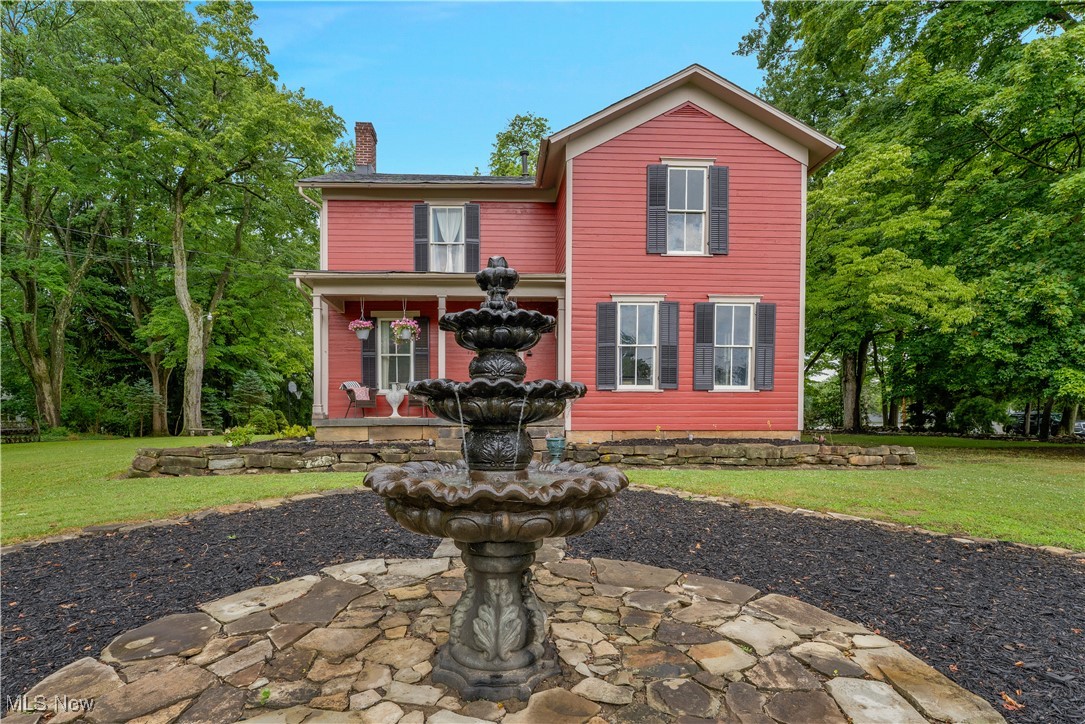 Step into a world of timeless charm with this captivating 1865 farmhouse, now available for sale.
Nestled on a serene 1.3-acre wooded lot, this 4-bedroom, 2-bathroom treasure radiates whimsical, storybook charm, blending historic grandeur with modern elegance.
Towering black walnut trees form a majestic canopy over the property, creating a shaded, enchanting retreat.
A stunning fountain in the front yard welcomes you to this two-story masterpiece, featuring meticulously restored original 1800s flooring, three magnificent fireplaces, and soaring 6-foot-tall windows that flood the home with natural light. The lofty ceilings throughout enhance the home’s airy, timeless ambiance, preserving nearly all of its 19th-century splendor. Thoughtful modern updates include beautifully renovated bathrooms and kitchen, seamlessly integrated with the home’s historic character. The greenhouse sun porch offers a serene retreat, while the park-like grounds feature an outdoor fire pit, a captivating outdoor movie screen, and a spectacularly finished she-shed – perfect for creative pursuits or quiet escapes. A spacious three-bay carriage house, capable of hosting three vehicles, provides ample space for storage, a workshop, or future expansion. With abundant parking, the property is ideal for hosting gatherings and parties for friends and family.
Once a thriving farm, the property retains its pastoral charm with vintage farm equipment thoughtfully displayed, adding to its unique character. This private oasis feels like a countryside escape, yet it’s conveniently located in the heart of everything, offering both seclusion and accessibility for you and your family.
More than a home, this enchanting farmhouse is a lifestyle, blending history, whimsy, and modern luxury. Schedule a private tour today to experience this extraordinary property and let it capture your heart!