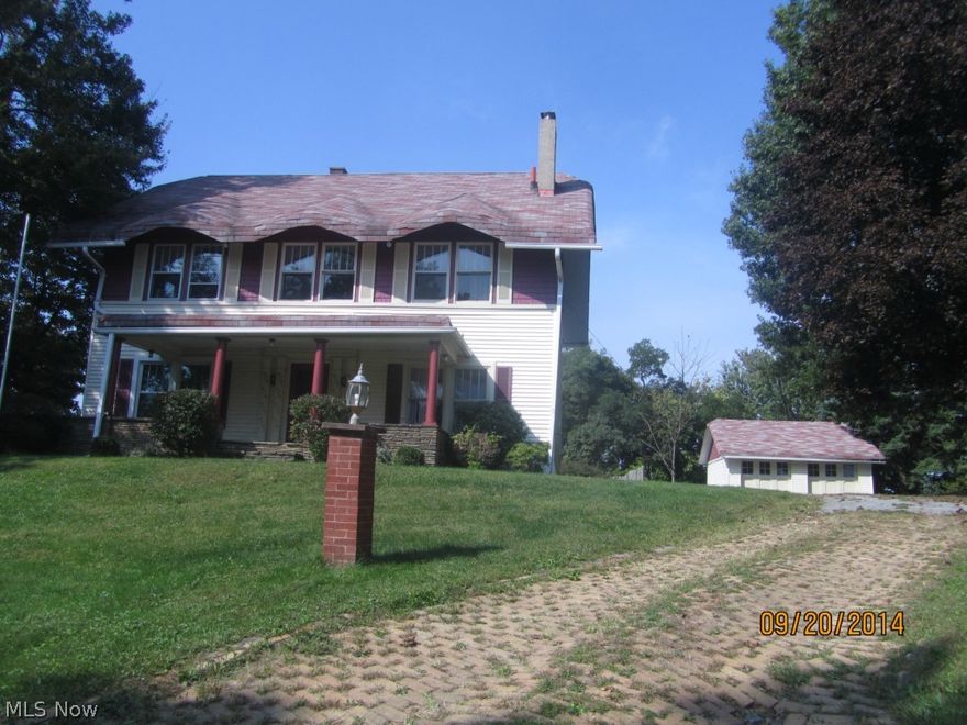 Stone patio overlooking  the Ohio River Valley! Newer fully equipped kitchen, formal dining room, living room with a fireplace that has a woodburning insert, flanked by bookcases.  4 bedrooms with cedar lined closets, additional closets in the walk up attic. View of the backyard from the second story porch enclosure. This desirable home has features that are hard to find with a large acre yard.