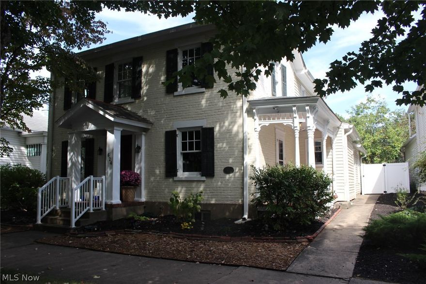 Charming Georgian home built in 1835.  Live downtown on picturesque brick street close to schools, the library and hospital.  Updated modern infrastructure and amenities.  Top of the line ,Windows, Dual HVAC Units, Tank less Hot Water Heater, Newer Roof, Oversize Graded Gutters, CCTV Camera System, Custom Mahogany Cabinets and Fireplace Surround, Glass tile accents and LOADS OF UPDATES. Open floor plan with large rooms for entertaining.Relax in your secret garden  with a privacy and fire pit, enjoy perennial herb and flower gardens.