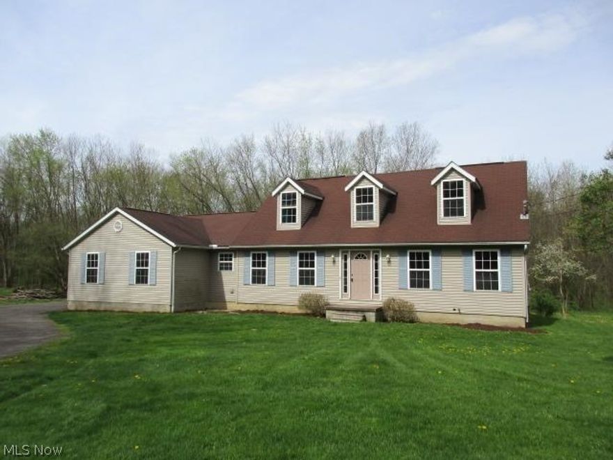 Enjoy country living close to town, this newer cape cod home on 5.41 acres offers large open kitchen/family room combo plus formal dining room & living room.  The 1st  floor also includes a laundry room, half bath and Master suite w/ shower  & whirlpool tub on 1st floor. 2nd floor features 2 bedrooms and additional full bath. Large open basement could easily be finished.  2 car attached garage and central air complete the package.