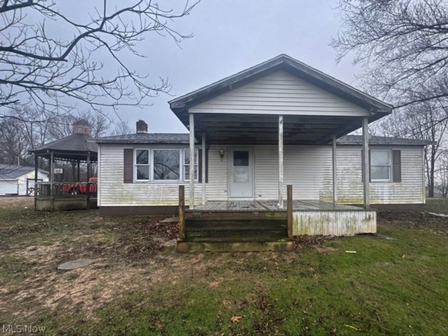 Check out this 2 bedroom home with 1 and 1/2 baths that sits on over 2 acres of land. The paved driveway goes behind the singlewide (a separate parcel and not for sale) to the 2 car detached heated garage. 
Home has a full basement could be utilized for more living space if desired. On the property there is also gazebo, a pole building and a large shed for extra storage. Call you Realtor today for your showing.