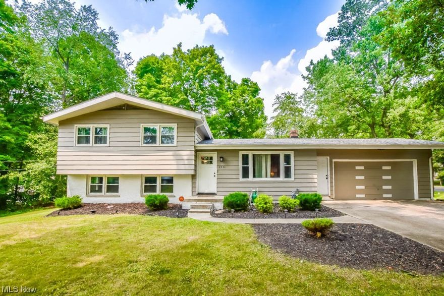 Move right in and enjoy this wonderfully updated split-level in Plain Local Schools!  Spacious main floor with a great flow between the front living room with a big picture window and vinyl plank flooring that continues into the eat-in kitchen complete with quartz countertops and new stainless steel appliances! Up a few steps you'll find three nicely sized bedrooms with generous closets and a modern full bath with a tub/shower with tiled surround. The versatile lower level adds a family room/ rec room with a convenient full bath and walk-out access to the patio and backyard. This home is perfectly located in a quiet neighborhood yet close to schools, shopping Gervasi Vineyard and Middlebranch Trail. Updates within the past 3 years include the roof, windows, furnace, hot water tank and more!  Don't miss out, call to see all that this home has to offer today!