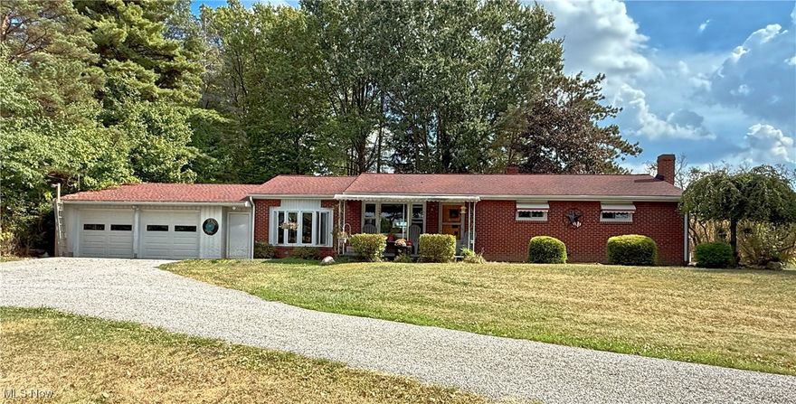 Looking for a little bit of country? This 3-4 bedroom, 2.5 bath, brick ranch in West Branch Schools is a rural gem, set on 1 acre, with a welcoming covered porch, a convenient horseshoe driveway and vinyl windows that were updated just a year ago. 
Step inside and discover a layout full of versatility. The original living room, with hardwood floors, is now being utilized as a spacious dining room, perfect for gathering around the table. The breezeway has been converted into a large living room with its own electric baseboard heat, LVT flooring, a bay window, a half bath, and sliding glass doors that open into the 3 season/sunroom, where you can relax and enjoy the views of your own slice of the countryside. 
The kitchen is generously sized with an abundance of cabinetry and counter space, and the stove, refrigerator, and dishwasher all stay. Down the hall, you’ll find three bedrooms—one currently used as a closet, another for storage—and a full bath with a tub/shower combo. The finished basement is a true bonus, offering a rec room/family room with tongue-and-groove hardwood walls and a propane fireplace (the propane tank can stay). There’s also an optional 4th bedroom/office with 2 double closets and a spacious laundry area that houses another full bath (the step-in shower is being used for storage) and a hallway of storage closets. This home offers the space you need, the charm you’ll love, and the country setting you’ve been looking for. Come take a look, you might just picture yourself calling it home.
