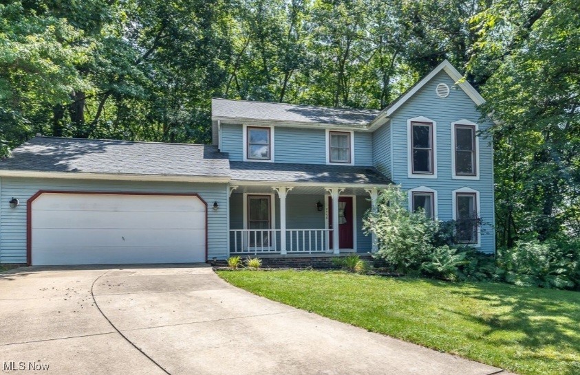 Welcome to this charming 3-bedroom home nestled on a quiet cul-de-sac, featuring a private wooded backyard and walkout basement! Enjoy peaceful mornings on the screened-in deck or relaxing evenings on the inviting front porch. Inside, you'll find a desirable first-floor laundry room and an updated master bathroom (2017). The partially finished basement offers great space for entertaining or the potential for a 4th bedroom. Major updates include a new roof (2020), furnace (2019), and central air conditioning (2023). The kitchen boasts stainless steel appliances—microwave, refrigerator, and dishwasher—all replaced within the last 4 years. All appliances stay, making this home move-in ready!