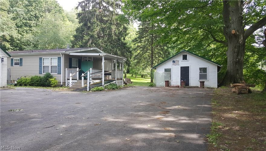 Hidden high on the ridge, this 3 bedroom 2 bath manufactured home sits on nearly 3 acres of peaceful, tranquil property. Large master bedroom features a master bath and walk in closet. Open floor plan is ideal for modern living. Skylights, city water and large deck plus a 2 car garage and a storage shed. Enjoy your own hidden oasis with easy access to Rt 11 and I-90.