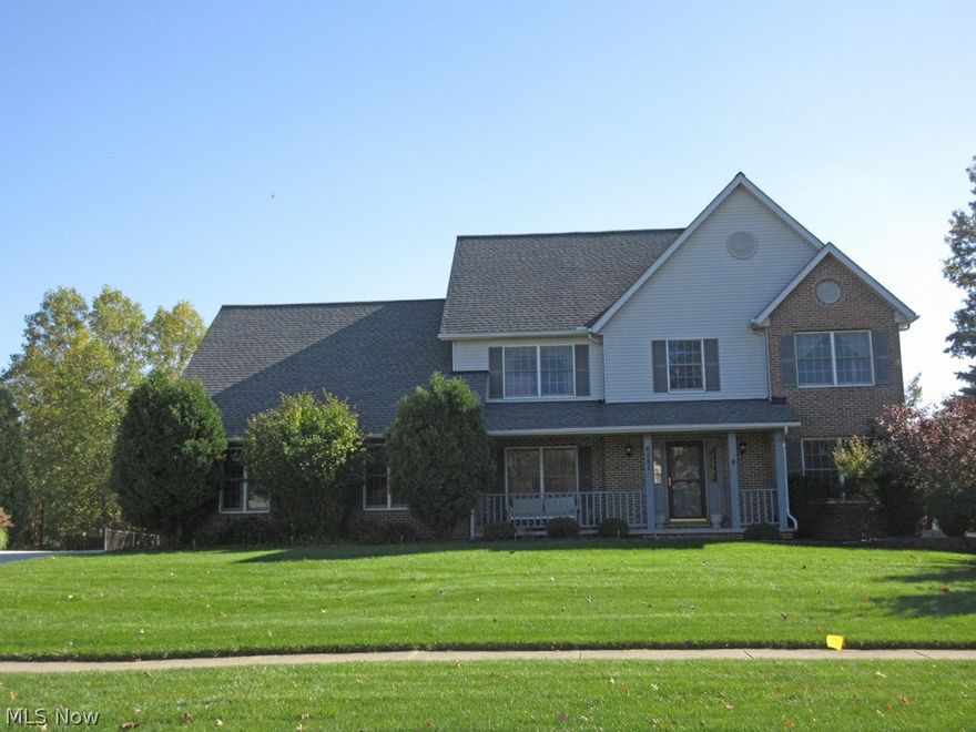 Beautiful 4/5 bedroom, 4.1 bath colonial situated on a private setting in Sherwood Highlands.  This spacious home offers a welcoming front porch, formal living & dining rooms, and a kitchen with a center island, oak cabinets, and all appliances. The kitchen opens to the family room and has a wood burning fireplace.  There is gorgeous, newly installed hardwood flooring throughout this home.  Finishing the 1st floor is a 5th bedroom or a den with a full bath, perfect for an in-law suite, a guest bath, and a laundry room. The upstairs offers a master suite with a glamour bath, jetted tub, double sinks, huge walk-in closet, 3 additional bedrooms, and a main bath with double sinks. Updates include: roof (2012), furnace and C/A (2012), driveway, patio, and out-building. The full, finished basement includes a walk-out to the garage, great for storage, a recreation room, a full bath, workshop, bedroom, a full kitchen, and an abundance of storage. Completing this offering is a newly built 2 ½ c