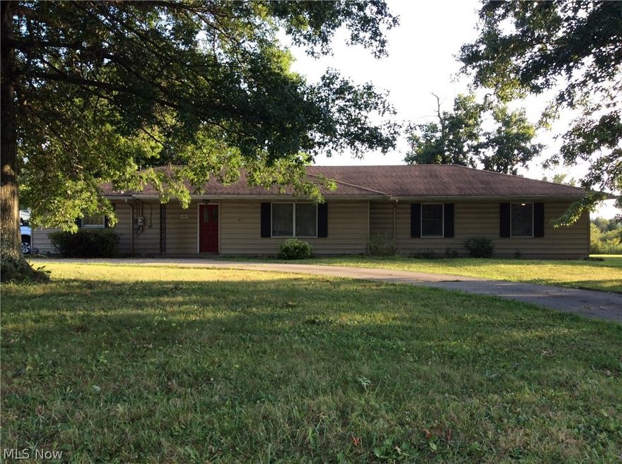 Spacious 3 bedroom, 2 full bath home with a circular drive out front. New carpeting & flooring throughout. Both bathrooms have been updated. island in kitchen w/plenty of counter space  cupboards. Lots of storage space.