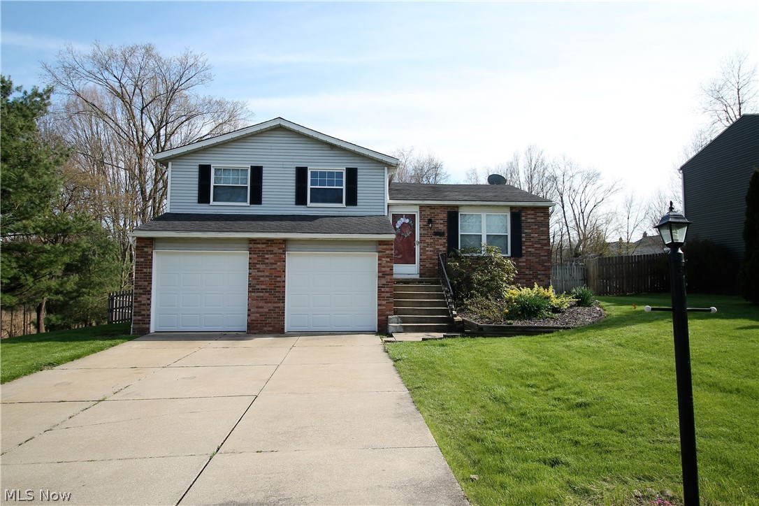 Own with pride! Welcome to this charming three bedroom, two full and one half bath split level home. Come on into this classic, comfortable home offering a Smart Nest door bell, thermostat, smoke and carbon detectors that leads to the large living room, dining room, open kitchen and all three rooms have new wood flooring (2018). The dining room has a new slider door that offers natural light to shine through, and leads to the large stained deck (2019) and large backyard. The remodeled bright and cheerful open kitchen offers abundance of new counters and cabinets (2018). Upstairs you will find that all three bedrooms have been updated with new carpet (2018), new ceiling fans and lighting (2018) as well as new closet doors. The upstairs bathrooms have all been updated (2017 & 2018) with new ceramic tile, granite, tub surround, toilet. The lower level has new carpet (2018), it was currently used as a fourth bedroom but could be used as a family room, office, etc. there are endless of