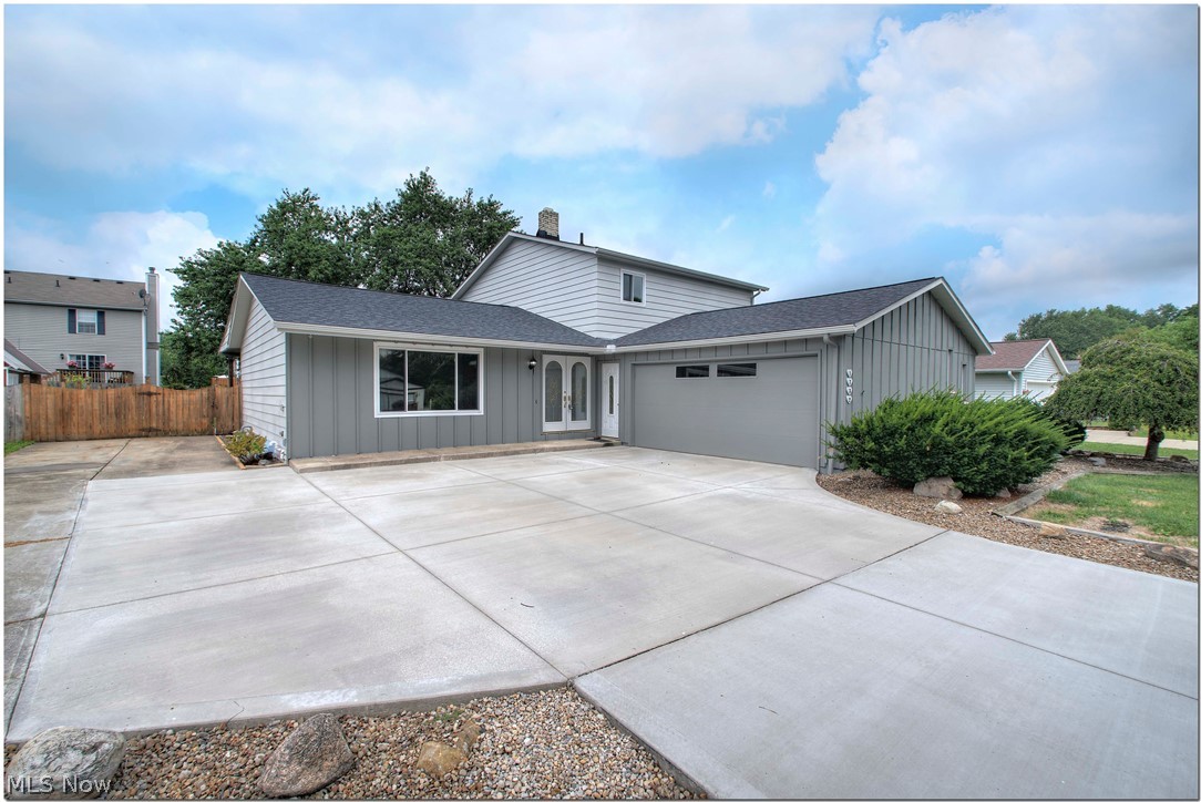 Be first of be sorry! Completely renovated split with a fenced in yard, enclosed patio, new cement driveway with extra storage for RV or boat owners. Almost everything is new throughout. Wait to you see the kitchen on this one! Gorgeous cabinets, counter tops, abutting a huge dining room that exits on to a covered wood deck. Enclosed patio off the family room. Recessed lighting throughout. Water proof vinyl plank flooring throughout. Recessed lighting throughout. Extended ceiling height gives it an even more open look. Easy step in shower in one bath, and a huge bath in the other. Basement is full and just waiting for your imagination. Seller will update / change fireplace in living room if buyer does not like stone.