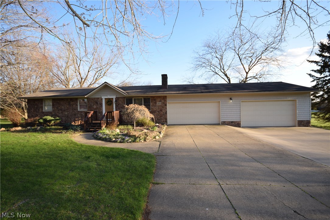 Beautiful Ranch with 3 bedrooms and 2 full baths, wood floors, huge gourmet kitchen, 3-level deck with one portion covered and hot tub, family room/sun room, full basement, mud room, tons of storage space, 4-car garage attached + 1 car detached in the 20 x 24 barn with extra storage. You have to see this home to believe how beautiful and spacious it truly is! Flat lot with 270 feet of frontage which creates a very private feel given all the distance between neighboring houses. Recent updates include: roof(2000), high efficient furnace(2014), A/C(1999), water softener(2004), addition of extra attached garage and vinyl siding(2002), electrical upgrade(1997), upgrades to the kitchen including brand new counter-tops and large ceramic tile floor. Schedule your showing today! As soon as you step in the front door you'll find this one a great value!