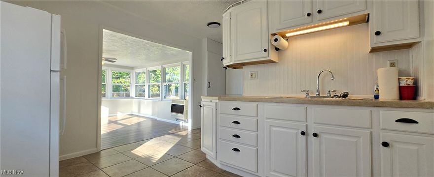 Introducing this charming one story home, perfectly located with Homewood Park just steps away, offering a beautiful wooded rear view. Step into a spacious sunroom/family room that's perfect for all seasons. The home comes with all appliances included, even the washer and dryer, making it move-in ready. Enjoy immediate possession and a clean, bright living space with an open floor plan. The property features a one car garage, a fenced in backyard, double closets in two bedrooms and a large covered front porch, ideal for relaxing. Don't miss out on this gem!