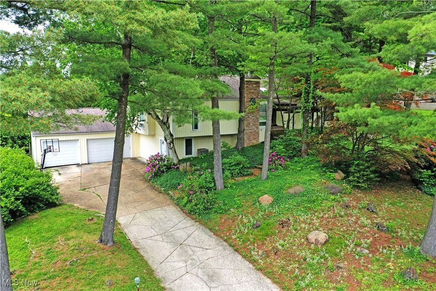 This unique home in a desirable Canfield neighborhood is ready for a new owner. Don't miss your opportunity to snatch up this spacious home with so many unique features, including an in-law suite or income suite in the lower level w/full kitchen and access to the laundry room. Sliding glass doors throughout both levels provide access to upper-level decks as well as the lower-level patio with an in-ground pool. This home exudes character,  it just needs a little TLC. The generously sized bedrooms and ample closets are sure to please as will the wood style floors, spacious rooms and high ceilings. Newer roof and siding. Call today for your private showing! Home is being sold in AS-IS condition, seller to make no repairs.