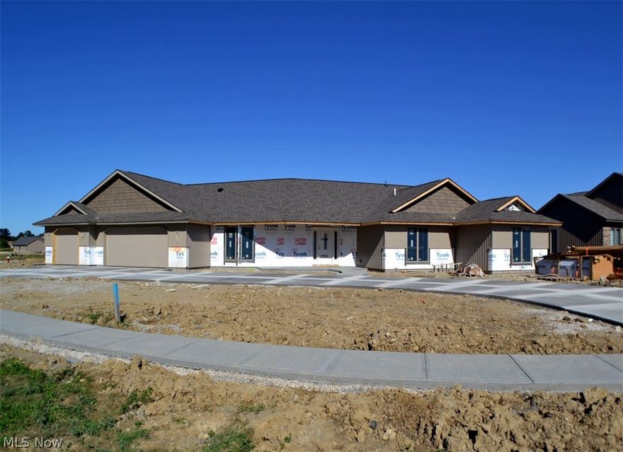 Home is under construction. This fantastic custom-built cluster home features a spacious grand room with vaulted ceiling and large dining area, wonderful kitchen with custom cabinets, granite counter tops, tile backsplash, snack bar island, walk-in pantry and skylight, three spacious bedrooms - master suite with full bath with granite top vanity, walk-in shower, and spacious dressing room with custom wardrobe chests, office with cathedral ceiling, mud room, large laundry room, fantastic 35' x 13' hobby/rec room  with tray ceiling, covered rear porch, upgraded lighting and plumbing, spacious three car garage with hot and cold water, full drain, door operators, pegboard and pull-down stairs to overhead storage.  Subdivision clubhouse, fitness center, Olympic-size pool, children's pool and play area.  Numerous single family and cluster home building sites are available.