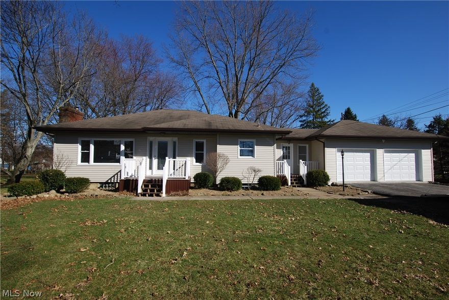 You are going to FALL IN LOVE with this completely updated 3 Bedroom Home in Columbiana. The entire home has been updated including New Kitchen, New Flooring, New Bathroom, New Doors, New Windows, New Furnace, AC, HWT and New Concrete Floor in 2 Car Garage. Ceramic Tile in the Kitchen, Bath and Enclosed Breezway leading to the Attached 2 Car Garage. New Carpet in the Bedrooms. Living Room and Hallways are Laminate Floors. Large Backyard.