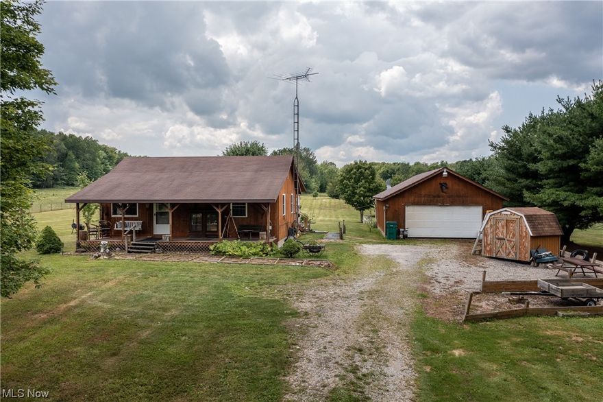 Welcome to country living at its finest! A long, gravel driveway leads you up to this 2 bed, 1 bath cabin that is nestled on a beautiful 10 acre lot with many features to enjoy. The inviting front porch will draw you in to sit and relax. Inside, the open concept living room and kitchen offer plenty of space with lots of natural light. Down the hall, you’ll find two bedrooms and a full bathroom with a walk-in shower and laundry. The den provides additional living space with a sun porch off the back of the home with screened in windows. A 24x40 detached garage with electricity offers lots of space for cars, toys, or a workshop. A large 30 ft deep pond is stocked and ready for fishing. In the back of the property, there is a little pavilion with a picnic table. This beautiful property is just 15 minutes from Pymatuning State Park and 30 minutes from Lake Erie beaches.
