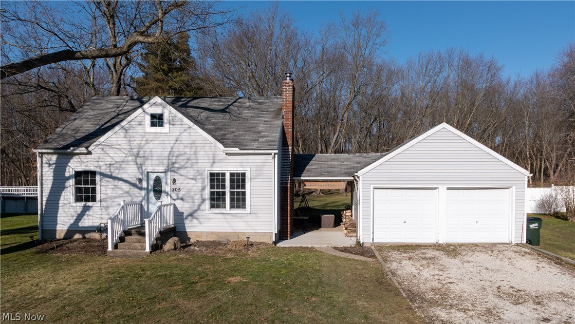 Don't miss out on this 3 bedroom Cape Cod on nearly 1 acre in Tallmadge! Renovated and ready for you to move in and make it your own! Fresh paint from top to bottom and new flooring throughout the entire home! The first floor features a cozy living room with a wood burning stove, completely remodeled kitchen and bathroom, and 2 first floor bedrooms. The second floor includes a spacious master bedroom with ample closet space. The full basement includes a utility/laundry room and a separate rec room. The detached 2 car garage has plenty of room for your vehicles and storage. Enjoy the outdoors on the covered patio and deep wooded backyard. Additional updates include new windows, exterior doors, new led light fixtures throughout, new electric panel, new furnace and AC. New chimney crown, cap, liner, flashing, some new mortar, and the brick has been waterproofed. Appliances stay including washer and dryer. Includes a 1 year home warranty. Call today to schedule your private showing!