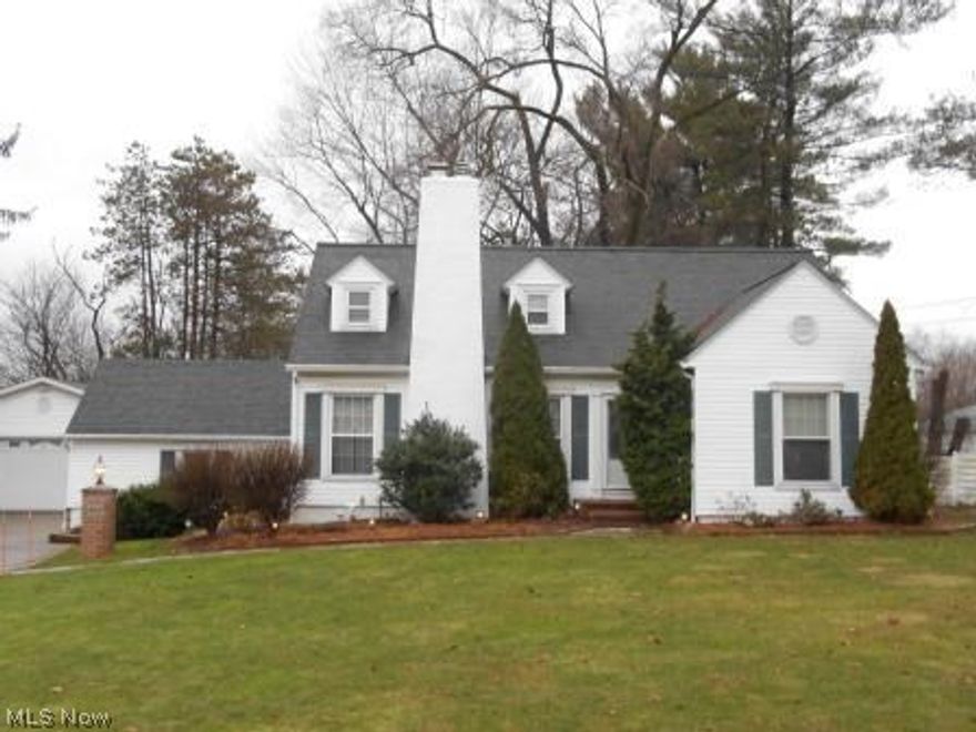 SPACIOUS 4 BEDROOMS, 3 FULL BATH CAPE located on a one-acre lot near I-77.  Large and inviting living room and dining room features hardwood flooring and a gas fireplace.  The kitchen off the dining room offers plenty of storage space and come fully applianced.  Basement is completely finished with a family room, gas fireplace, bar, full bath, large laundry room and an extra room that could be used as an office.  Home also features central air, attached one car garage and a detached 28 x 32 two car heated garage.