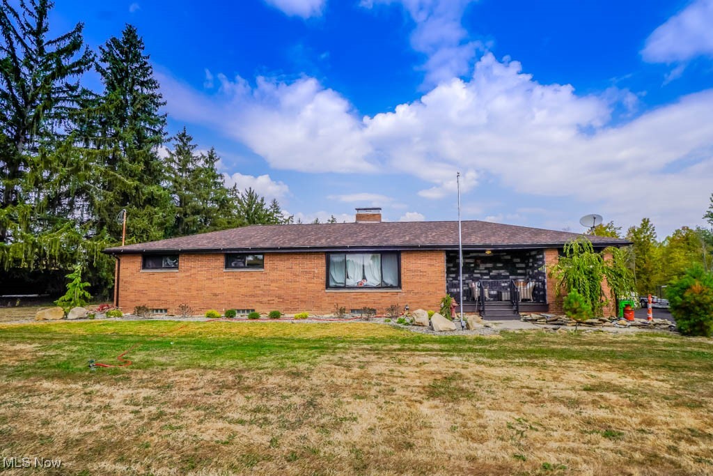 Enjoy single floor country living in this beautifully updated brick ranch on 2.21 acres! The living room features hardwood floors and a fireplace, while the eat in kitchen offers stainless steel appliances, granite countertops, and space for dining. Down the hall are three bedrooms with hardwood floors and a full bath. The lower level expands your living space with a second fireplace, a recreation area, and another full bath.
Step outside to an amazing backyard with a pergola topped patio and an incredible outdoor gathering spot that includes a built in kitchen with grill, refrigerator, and a lounge area in front of a stone fireplace. An attached two car garage plus a detached two car garage provide plenty of space for parking and hobbies. Updates include a newer roof, furnace, A/C, and hot water tank. With a great location close to amenities and within the Marlington school district, this is a rare find you won’t want to miss!
