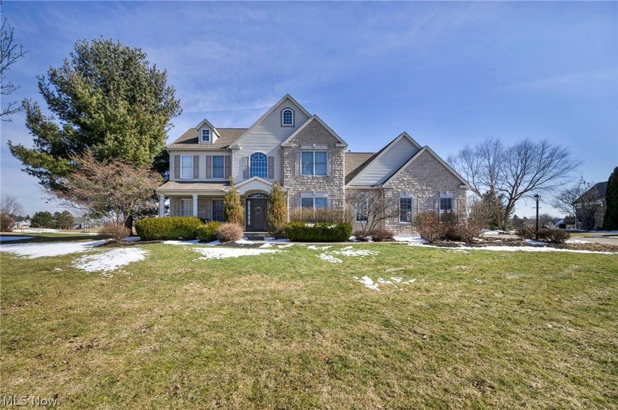 Welcome to this beautifully maintained 4-bedroom Colonial located in the prestigious Fox Meadows Golf Community, offering stunning views and exceptional outdoor living. Step inside to a grand two-story foyer with soaring ceilings that sets the tone for the home’s spacious and elegant design. A private office is conveniently located off the entry, while the formal dining room showcases a stunning double tray ceiling. The bright and airy kitchen features granite countertops, stainless steel appliances, and abundant natural light, flowing seamlessly into the inviting great room with a cozy gas fireplace. Upstairs, you’ll find all four bedrooms, including a spacious owner’s suite with vaulted ceilings, a private sitting/bonus room, walk-in closet, and a well-appointed ensuite bath complete with double vanity, soaking tub, and separate shower. The second floor also includes an additional full bathroom, while the home offers two convenient half baths—one on the main level and one in the finished basement. The finished lower level is ideal for relaxing, featuring a granite bar and ample space for recreation and gatherings. Step outside to your private backyard retreat overlooking the Fox Meadows Golf Course. Enjoy the large stamped concrete patio and newly added 16x16 pavilion (2020), complete with a gas fireplace, gas torches, built-in grill, and pizza oven—perfect for entertaining while taking in the scenic views and sunsets. Additional highlights include a 3-car attached garage, first-floor laundry, updated light fixtures, new carpet throughout, and major mechanical updates including a new roof (2020), air conditioner (2018), and hot water tank (2021). Furnace recently serviced for added peace of mind. This exceptional home combines comfort, style, and outdoor luxury in a highly sought-after location—don’t miss your opportunity to make it yours!