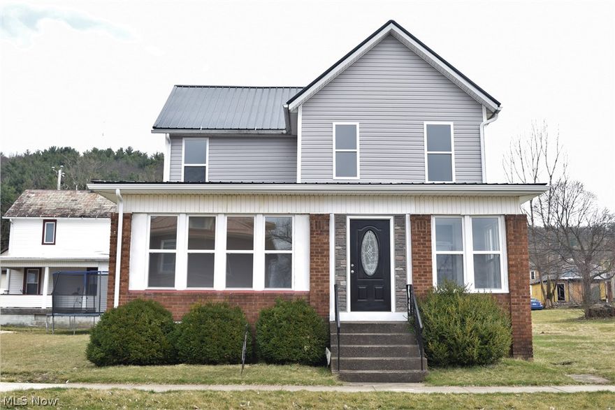 Fabulous 4 bedroom home ready for your personal touch. So many updates - metal roof Dec. 2019, siding, windows and doors 2020. New eat-in kitchen with appliances, remodeled bathroom and 1st floor bedroom. New flooring throughout. Large lot extends to alley. Don't miss this rare find.