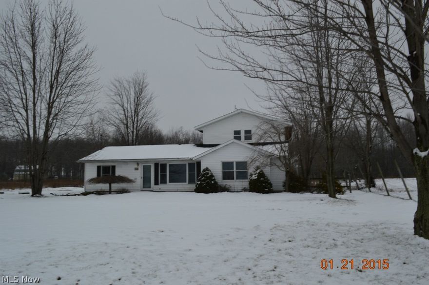 2 bedroom 1 bath home located on 1 acre. Interior is approximately half finished, the rest is down to the studs. A second bath and 2 bedrooms have been framed in but no mechanicals have been connected to the new space. The exterior features a large deck and a  34x44 outbuilding with 3 bays, poured floor, partially insulated, mechanics pit and more. This home may not qualify for some types of financing. Property is being sold AS-IS.