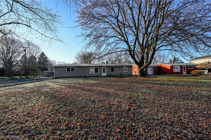 Beautifully updated ranch now available in the charming Red Fox neighborhood!  Perfect location centered between Streetsboro and Shalersville, near the turnpike and in the Crestwood school district.  Large corner lot with a beautiful front yard, complete with tire swing in the tree.  Out back is a pull through driveway, leading to the 2 car garage for tons of parking, a deck and patio to hang out plus a shed.  There is also a great space for a second garage/building, then you could convert the attached garage into more living space!  Speaking of, come on in to check out all the fantastic updates!  Fresh paint throughout, brand new Luxury Vinyl plank flooring in the living room, hall and all three bedrooms.  Bathroom has a total refresh with new toilet, vanity, medicine cabinet, lighting and tub surround!  Open floorplan between the kitchen and living room with a grand feeling vaulted ceiling.  Large eat-in kitchen features ceramic tile flooring, plentiful maple cabinetry, solid surface