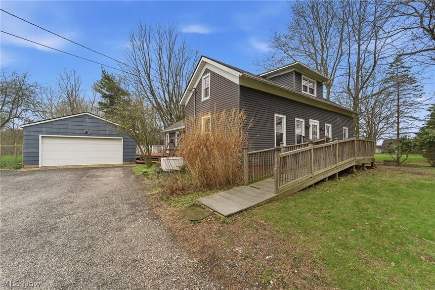 Sitting on a gorgeous 1 Ac lot this 5 Bedrooms 2-Story home is reminiscent of a Western Reserve Salt Box style & full of charm!! Three 1st-floor Bedrooms - one of which offers a Half-Bath.  Remodeled Kitchen in 2014, 1st-floor Laundry, 2 Dormer Bedrooms on the 2nd level, with a full bathroom. You'll love the large Wrap-around Deck for relaxing & entertaining. This home features a whole house generator, new furnace, heat pump in 2022, new hot water heater in 2025, new roof with gutter guards, garage door & windows in 2015. Septic was inspected & has passed LCHD 3/25/2026. Sellers will be leaving their lawn mower with plow attachment.