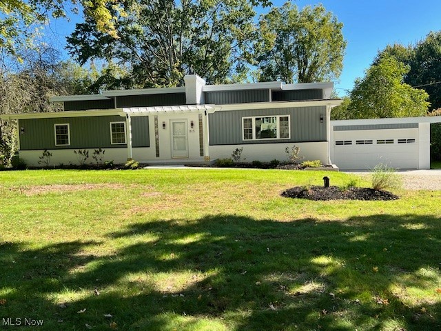 No room has remained untouched in this fully renovated split level in Copley. Make this move-in-ready gem the next place you call home! The outside boasts a contemporary curb appeal, adorned with modern lighting around the perimeter. A pergola crowns the front entry and welcomes visitors, while the new composite deck and concrete patio ensure outdoor bliss in the back. The two-car, oversized, heated garage has amenities that will make any vehicle happy! The main level unfolds into a spacious living room, featuring a wood-burning fireplace, contemporary wall sconces, and scenic windows. A luxurious master bedroom and en suite bathroom oasis share the space on this level. The upper level includes two spacious bedrooms and a stunning main bath. A cozy dining room provides direct access to a morning room and an amazing kitchen, which features stainless steel built-ins, soft-close cabinetry, and beautiful granite countertops. The lower level has walk-out access to the back patio and garage. It includes a large laundry room, plenty of storage options, and yet another full bathroom. A beautifully designed recreation room, with glass block windows and modern wall sconces, complements this level and completes this lower bonus space. Don't miss out on this hidden jewel! NEW ROOF - 2025! Call today to set up your private showing.