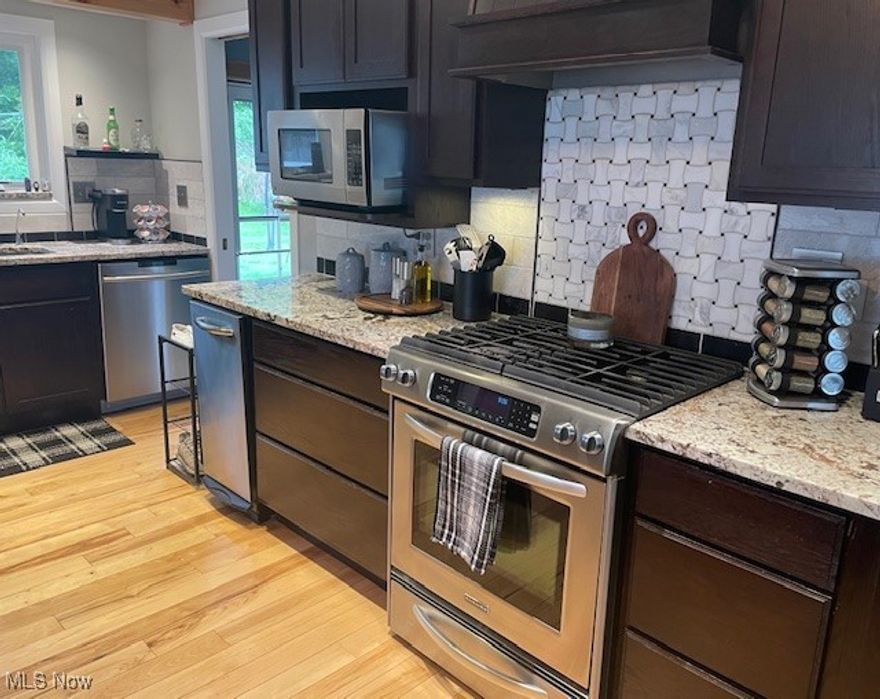 Move right into this charming 4 bedroom 1 and a half bath single family home. the kitchen is totally updated with plenty of storage, granite countertops, marble backsplash, eat-in area and beautiful hardwood flooring that flows through the kitchen, living room, and hallway. All four comfortable sized bedrooms are on the first floor with the Master bedroom having its own half bath. The basement is partially finished. All the stainless steel appliances are included. The backyard is fully fenced in. The home is conveniently located close to parks, bike park and Chardon Square. Plus the home comes with a 1 year warranty from America's Preferred Home Warranty. Call today to schedule your showing!