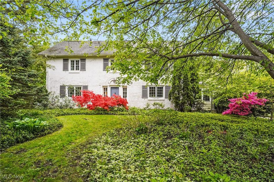 Situated in one of West Akron’s most historic areas and just 2 blocks from the prestigious Portage County Club, this all brick, custom-built Colonial has been nicely updated to meet the needs for today’s modern necessities, while blending the character and architecture expected from a 1920’s period home. The sunken living room features hardwood floors, 2-sided gas FP, large windows, built-in bookcases and storage, leading to the enclosed sunroom with matching arched doorways and original tile floors. The recently updated kitchen (19) has been designed for today’s modern chef: huge center island, walnut cabinetry, large walk in pantry, double oven, hidden refrigerator, heated floors, and tons of storage. The adjacent dining with original hardwood floors and gleaming chandelier from NYC lighting district provides a great ambience for guests. The spacious, second floor master has two closets, with plenty of storage and bathroom featuring two sinks, steam shower, heated floors, Toto toilet, and tilework, recently completed in 2022. Additionally, the second floor features a reading loft, two more bedrooms with built-ins and storage, and full bath, updated in 2019. The third floor retreat features hardwood floors, full bath with tile shower, enormous bedroom, private office and a common space for rest and relaxation. Outside features a secluded and private back deck, terraced stone garden, gated circle drive, three car garage w 220 power for EV, and fully fenced backyard. The current owner has used one of the garage bays as an art studio, complete with heat and A/C. Basement features includes rec room, two storage areas, large laundry room, and canning room. Notable updates include: 3rd fl reno (25), Master (22), 2nd fl bath (19), Boiler (19). Close proximity to Stay Hywet, Portage CC, Highland Square, Metro Parks, shopping, schools, and entertainment. Don’t miss your chance to own a home in one of West Akron’s most historic and architecturally significant neighborhoods.