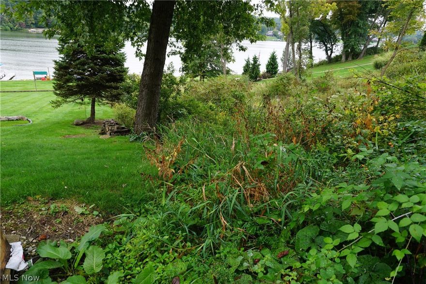 LAKEFRONT  Very nice lake views and this lot is located on main body of water.  Great location for your new lake house.  Lake Mohawk is a private, gated community with a golf course, tennis courts, baseball field, clubhouse, beaches and 500 acre lake for boating (unlimited horsepower), skiing, swimming and fishing.
Lake Mohawk is located 45 minutes southeast of Akron and 25 minutes from Canton.