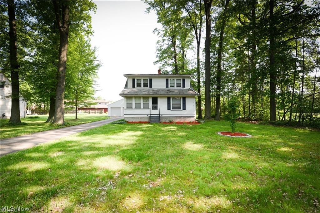 Motivated seller! Looking for a nice home that is close to the schools, shopping and restaurants? How about one with a large lot, two car garage and great deck to enjoy the summer? Well this home has all of that and more! This home offers awesome woodwork, gorgeous french doors from the living room to the formal dining room and a first floor bedroom! It even has a bath on each floor! Now, when you walk in you will find an enclosed porch off the front of the home, a great dining room and nice sized living room! The kitchen comes with appliances. Nice mudroom for your coats and shoes. Upstairs are two more nice sized bedrooms and a full bath! In the basement is another bath, laundry with a washer and dryer to stay, work bench area, and tons of storage space. The exterior has a nice deck overlooking a nice sized back yard. Guess what, the playset can stay! This home has a lot to offer and Seller even offering a one year 2-10 home warranty for the first year to the new owner!