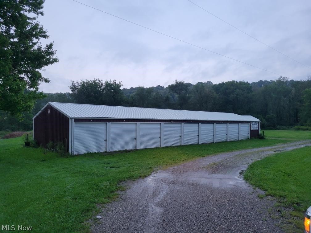 Attention Investors and Entrepreneurs. 24 Income producing storage units. 9 10x20 rents for $55 a month, 9 10x10 units rent for $45 per month, 6 5x10 rent for $25 per month per month. Rents are low compared to others in the area. There is also a 28x48 pole building with a concrete floor that rents for $500 per month. Great rental history, currently 100% rented. There is room for expansion. Agent owned