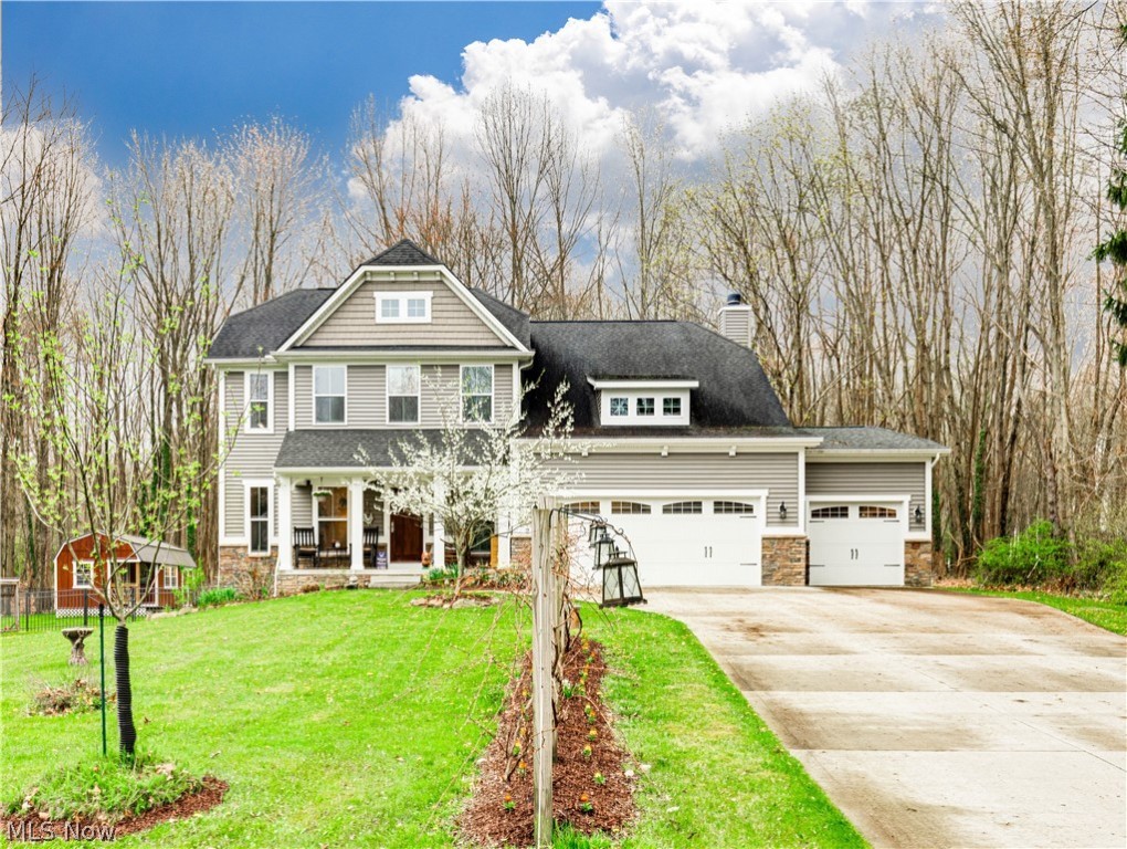YOU WILL LOVE THIS AMAZING CUSTOM COLONIAL BUILT IN 2014. YOU WANT COUNTRY-STYLE LIVING CLOSE TO ALL AMENITIES: SHOPPING (KOHLS, HOME GOODS, TJ MAXX, BATH AND BODY, ULTA, 3 MAJOR GROCERY STORES) , RESTAURANTS, BIKE TRAILS, SCHOOL, KENT STATE UNIVERSITY AND AKRON UNIVERSITY PLUS MUCH MORE. THIS ONE-OWNER HOME HAS 4-5 BEDROOMS (BEDROOM/OR OFFICE IN THE BASEMENT WITH INGRESS AND EGRESS), 2 FULL BATHS,, AND 2 HALF BATHS,2ND FLOOR LAUNDRY ROOM, OFFICE OR LIVING ROOM. THE KITCHEN OPENS UP TO THE DINING ROOM/EATING AREA. LOADS OF CABINETRY, FARM STYLE SINK, GRANITE COUNTERTOPS, CENTER ISLAND WITH A 2ND OVEN. THE GREAT ROOM HAS A FIREPLACE, LOTS OF WINDOWS, AND TRANSOM WINDOWS TO LET MOTHER NATURE SHINE THROUGH AND ENJOY THE OUTSIDE IN. THE BACKYARD IS FULLY FENCED WITH AN INCREDIBLE 12X24 6-YEAR-OLD SHED/WORKSHOP WITH A METAL ROOF AND SEPARATE ELECTRIC. ALSO, THERE IS A GAZEBO, AND METAL ROOF WITH A FAN AND TV MOUNT TO ENJOY THE SUMMER/FALL SEASONS. SURROUNDING THE BACK YARD IS GRAPEVINES, APPLES, PLUM, PEAR, AND CHERRY TREES..TO TOP IT OFF IF YOU LIKE TO FETCH FRESH EGGS, THERE IS A CHICKEN COOP! FULLY FENCED-IN BACKYARD. THE 2ND FLOOR OF THIS MAGNIFICENT HOME HAS 4 BEDROOMS. A SPACIOUS OWNER BATH WITH A LARGE TITLE WALK-IN SHOWER AND DOUBLE VANITY. Also, A 3-CAR GARAGE WITH A FULL-SIZE GARAGE DOOR OPENS UP TO THE BACKYARD TO PROVIDE EASY ACCESS FOR ALL YOUR OUTDOOR NEEDS THERE IS A SEPARATE SET OF STAIRS THAT LEAD FROM THE GARAGE THAT GOES DIRECTLY INTO THE BASEMENT FOR ALL YOUR STORAGE NEEDS.