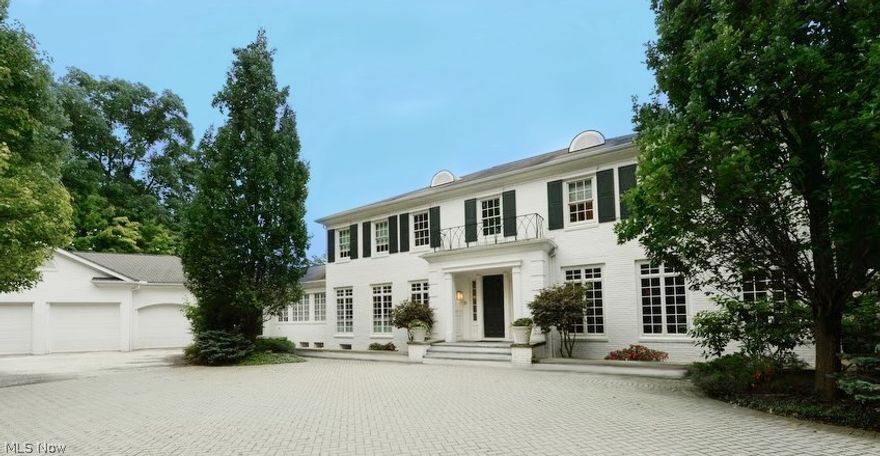 Drive down circular drive to the pinnacle of luxury at this 7,600 sqft all brick estate nestled in Bath Township.  Elegant lines and sweeping vistas are the hallmark of the sophisticated traditional yet modern architecture featured in this 4 bedroom 6 bath home.  Grand 2-story foyer greets you, flanked by dramatic staircase and library with custom built-ins and access to wet bar and half bath.  Expansive views of 8+ fenced in acres from formal living room and dining room with Donghia fixture transport you to the English countryside.  Beautiful white oak flooring and large floor to ceiling Andersen windows throughout home.  Chef's kitchen is open and bright with granite countertops, large island and inviting hearth room.  Large screened porch with gas fireplace overlooking grounds.  Exceptional master suite features cozy sitting area with gas fireplace, two separate baths w sauna and large his and hers walk-in closets.  Finished walk-out lower level has bedroom with en suite bath, large