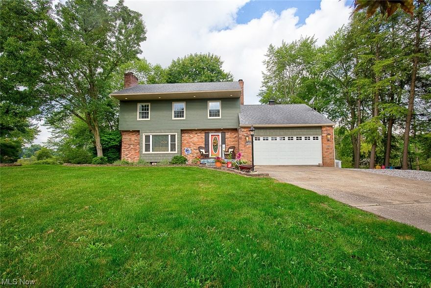 Welcome home to 2176 Ritz Manor Drive, a move in ready 4 bedroom, 1.5 bath colonial located on 1.1 acres! When step inside you will love the open foyer that gives your guests a great place to leave their shoes and coats during a visit. The large living room features an abundance of natural light and focal fireplace. The wood floors continue into the dining space and open into the fully applianced eat in kitchen! Step down into an additional living space with a second fireplace; currently used as a man cave and would also make a great home office or play room! This room gives you access to the back deck and views of your private tree lined backyard featuring a pond. Upstairs you will find 4 great sized bedrooms (including his and her closets in the master bedroom) and large remodeled full bath with dual sinks! Access to the attic space above the man cave/garage is just on the other side of the upstairs steps. The basement is a walk out and ready for your finishing touches! The garage has 220 plug. Updates include new siding 2021, roof about 2013, windows about 2014, front window 2022, hot water tank 2021, full bathroom remodel (2019) and more! Call today to schedule your private showing!