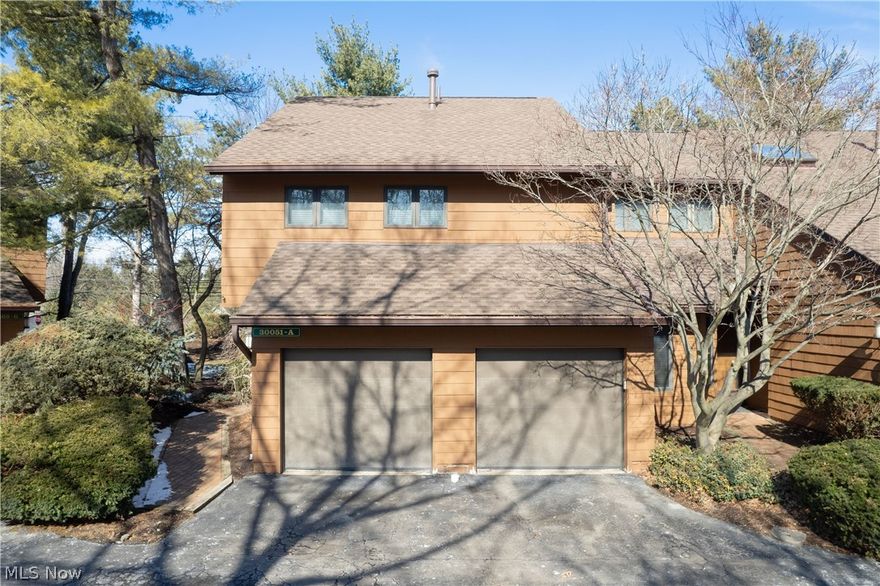 Discover this beautifully updated townhome nestled in the tranquil setting of Brentwood Woods. Featuring a modern floor plan with shed-vaulted ceilings and a skylight, the home is filled with natural light and contemporary charm. A rare two-car garage includes Nature Stone flooring that continues into the first-floor utility room for durability and style. The first floor offers a spacious, updated living and entertainment area with oak floors and trim throughout. Door leading to the back patio. The updated kitchen features stainless steel appliances, a breakfast bar, additional cabinet space, and modern finishes, and flows seamlessly into the formal dining room—perfect for entertaining. Upstairs, the primary suite includes a walk-in closet and a remodeled full bath with tiled shower flooring, updated countertops, and modern fixtures. A second spacious bedroom also features its own remodeled ensuite bathroom, offering privacy and comfort. The home also includes a recently installed reverse osmosis water filtration system with a warranty. Located just steps from Bradley Woods Reservation and minutes from Crocker Park, major highways, and the local recreation center, this property blends location, comfort, and style. The HOA handles all exterior maintenance, providing truly carefree living.