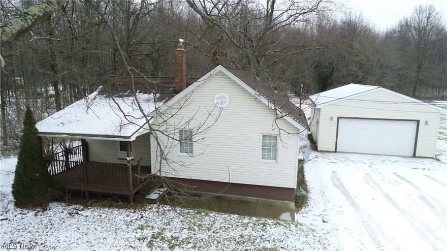 Totally updated 2 bedroom ranch on 5 acres, this home has newer kitchen, living room with cathedral ceilings, enclosed patio, newer roof, 2 car detached garage and more.