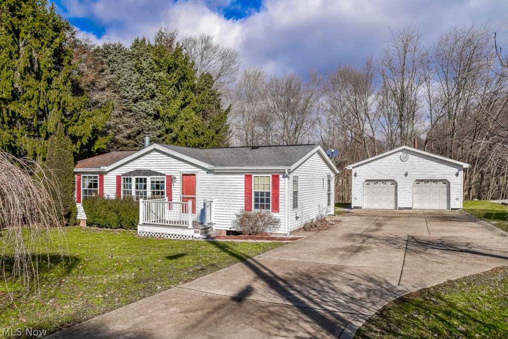 Great curb appeal at this 3 bedroom, 2 full bath ranch with vaulted ceilings! Open living areas perfect for entertaining! The great room boasts a lovely stone fireplace to keep you warm all winter. The dining room has a sliding door to the backyard and opens to the kitchen. The kitchen offers a dishwasher and pantry space. Split bedroom design means a quiet master suite with a private full bath and a walk-in closet. 2 additional bedrooms and a full bath on the other side of the home. First floor laundry room, too! Outside, the 2-car detached garage has a workbench and above storage space. Peaceful backyard is complete with incredible views! Come see all this home has to offer!