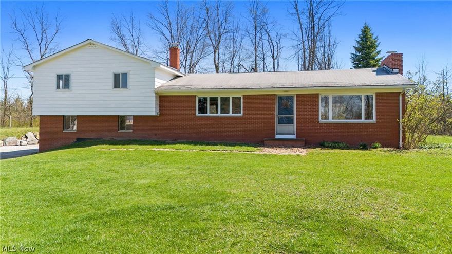 This Chester Twp Hobby Farm has many possibilities for your 4H family and homestead! This Split level home has great living space with 4 Bedrooms, 2 Full Baths and newer LVT flooring throughout the main level. Spacious Living/Dining Room combination with wood burning brick fireplace & sliders to patio. Eat-in Kitchen with all appliances. 1st floor Master Bedroom w/full bath access. 3 additional bedrooms on 2nd floor all have original hardwood floors. 2nd floor laundry. 2+car attached garage. Electric & water to large Barn with lean-to, front fenced pasture, back outdoor riding arena. This home is ready for a new family to make it their own! Selling AS-IS. West Geauga Schools.