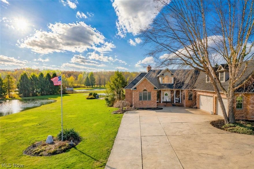 Welcome to your private retreat in East Canton, where quality construction, spacious living, and beautiful outdoor amenities come together on 3.67acres. This all-brick home offers over 3,300 square feet with 3 bedrooms, 2 full baths, 1 half bath, and a 3-car garage. A covered front porch sets the tone as you step inside to a welcoming entry and into the impressive great room, where vaulted ceilings, a striking wood-burning stone fireplace, and French doors to the covered rear porch create a warm and inviting focal point. The layout flows beautifully into the eat-in kitchen featuring cherry cabinetry, granite countertops, a center island with bar seating, newer flooring, stainless steel appliances, a separate cooktop, and double ovens that convey. A bright dining area with large windows offers peaceful views and walkout access, while the formal dining room adds charm with wainscoting.

A second main-level living room provides added flexibility for gathering or relaxing. The spacious primary suite features a tray ceiling, walk-in closet, and a beautifully remodeled bath with dual vanities, soaking tub, and tiled shower. Two additional main-floor bedrooms, both with walk-in closets, share a full bath with dual sinks. Main-level laundry and a convenient half bath add everyday function. Upstairs, the large loft offers endless possibilities for a home office, guest space, rec room, or hobby area.

The full lower level is unfinished but full of potential, with abundant storage, plumbing for a toilet, 3 sump pumps, and easy access to the garage. Outside is where this property truly shines. Enjoy the covered back porch, circular brick paver patio, in-ground pool with slide, two stocked ponds, and a beautiful 32x31 barn with electric and a covered porch. There is also underground water to the barn and garden. Surrounded by open views and tranquil countryside, this one-of-a-kind property offers the perfect blend of comfort, space, and peaceful outdoor living.