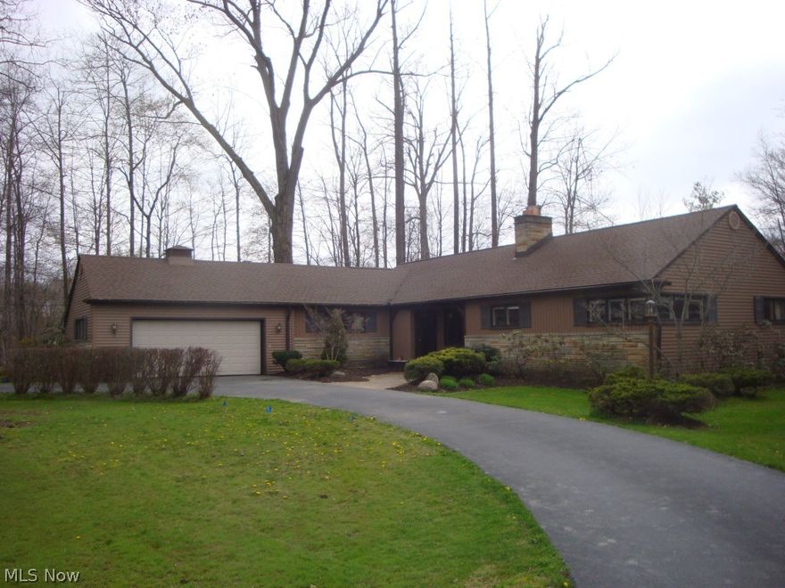 Just Reduced !!! Rambling Ranch in Chesterland. Peaceful private 3 acre wooded lot. Enjoy the wonderful view from a huge rear screened porch. Lots of recent improvements including new septic system,newer roof,new electrical panel box,new carpeting, new laminate flooring in kitchen,new garage door,new well pump. This stunning 3 bedroom ranch features a large great room with dramatic stone fireplace. The home features an additional first floor family room for entertaining with wet bar. The Large eat in kitchen is perfect for family living. All appliances are included in the home. The rear lot has a storage shed for lawn equipment..... the south side of the home has a partial fenced yard for kids or pets.... The maintenance free property is stone and vinly sided..the home is freshly landscaped and ready to move into...perfect location....easy living!! rare offering !