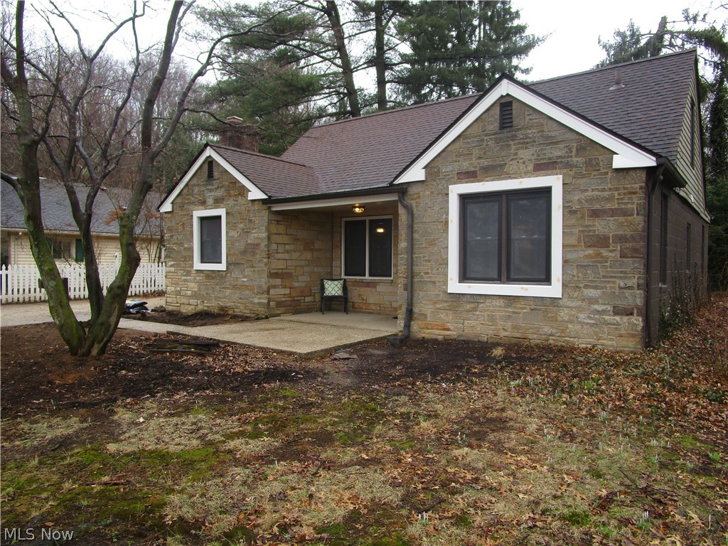 Renovated Stone Cottage in a prime West Akron location! Bursting with charm, this garden cottage has magazine worthy design and top quality renovations throughout. This home features so many original elements: hand hewn accent beams, 2 working fireplaces, exquisite exterior doors. This character has been combined with brand new renovations and modern farmhouse design throughout. The open concept kitchen sports white Thomasville cabinetry, stainless steal appliances, apron sink, ample pantry, a wood burning fireplace, and new light fixtures. Cedar plank ceilings and a second working fireplace grace the living area. Relax in the sun room with your morning coffee as you overlook the cottage garden path. Both bathrooms have been completely updated--Bathroom 1has a newly tiled shower/tub combo, encaustic-style flooring, new vanity, and updated light fixture. Bathroom 2 boasts a large walk in shower with waterfall shower panel with body spray. 3 large bedrooms with ample closet space. Bed